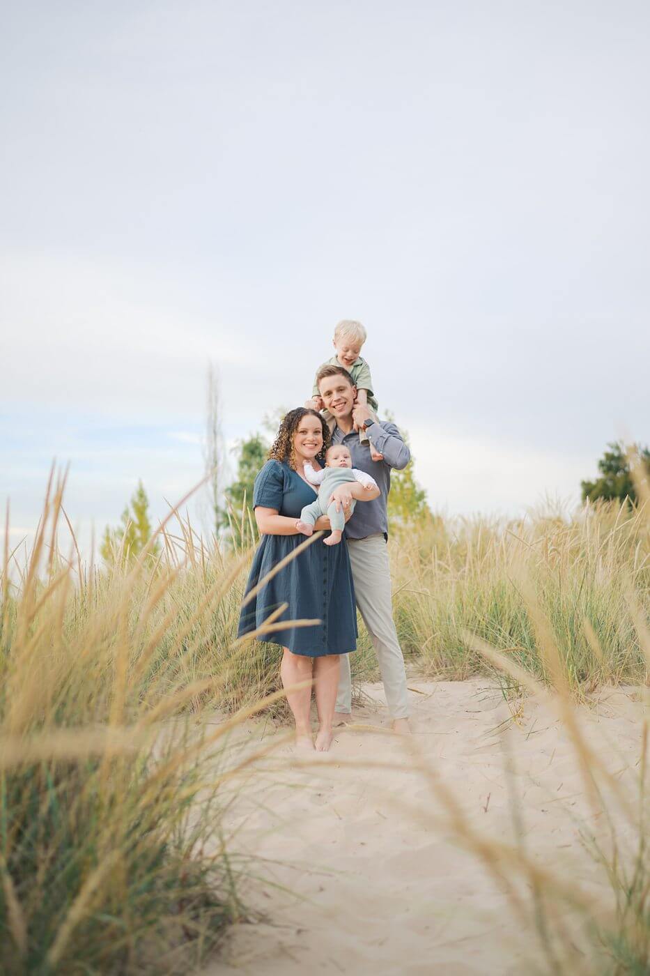 Family photos in the dunes in South Haven, Michigan at sunrise